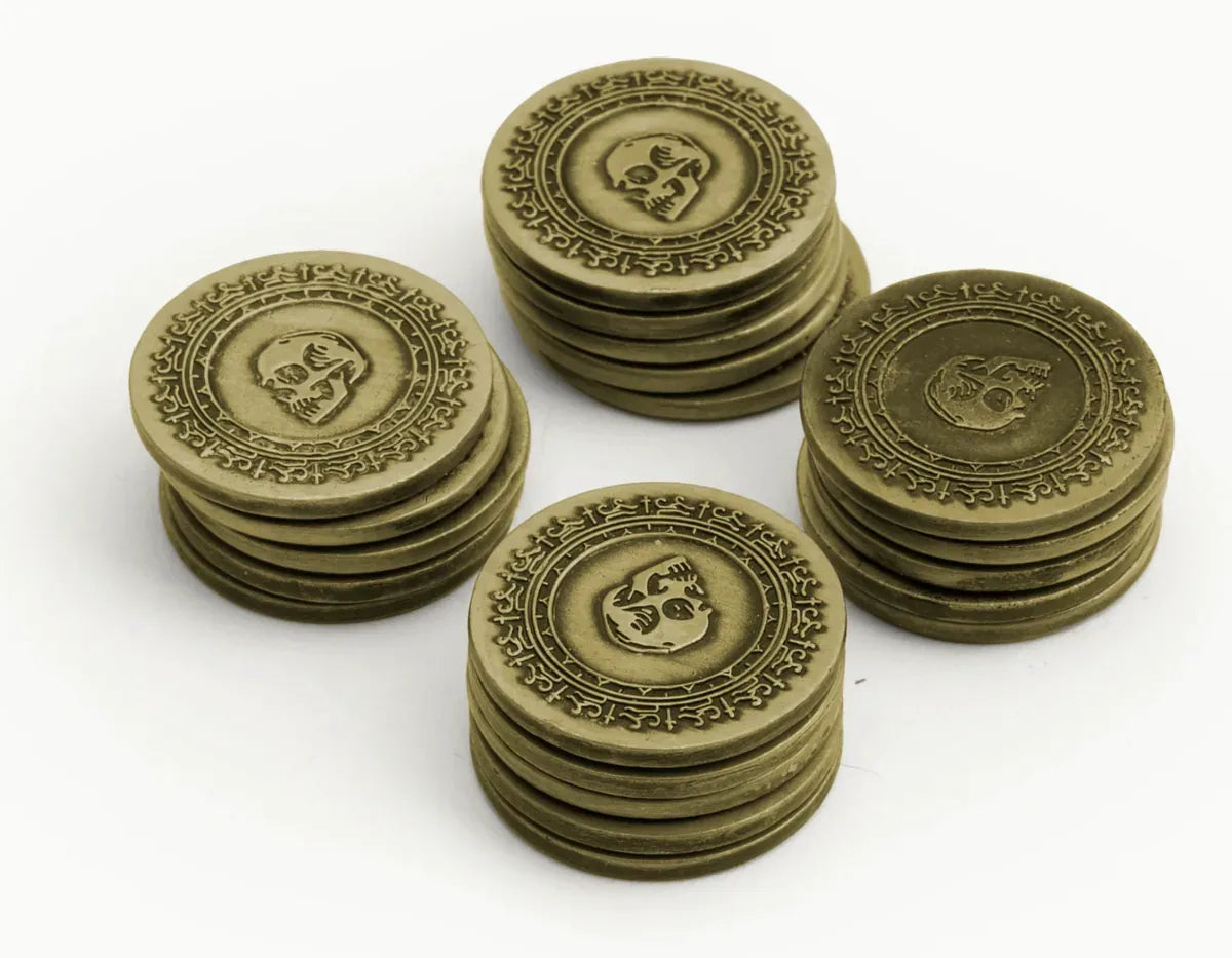 Four stacks of metal gold coins with a skull emblem