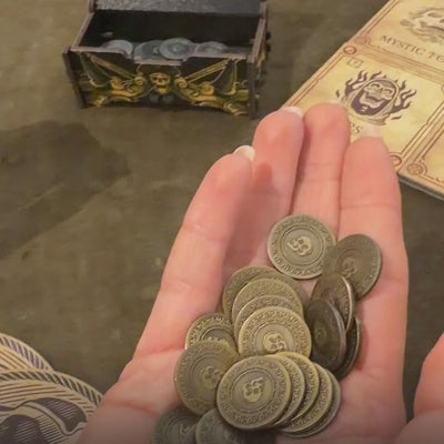 Gold Coins add-on: 20 metal coins worth 2 each, next to the silver coins from the Big Box