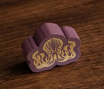 The wooden Kraken figure, purple with gold print